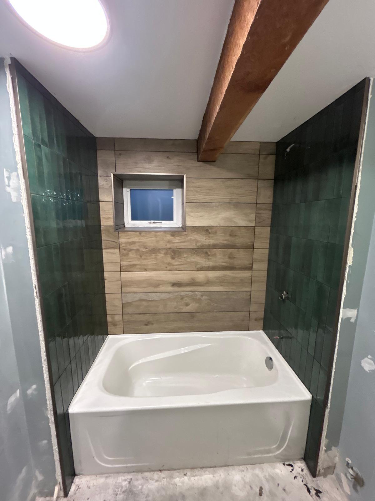 Wood plank tub green subway beam ceiling